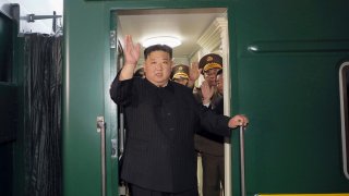 North Korea leader Kim Jong Un waves from a train in Pyongyang, North Korea, as he leaves for Russia.
