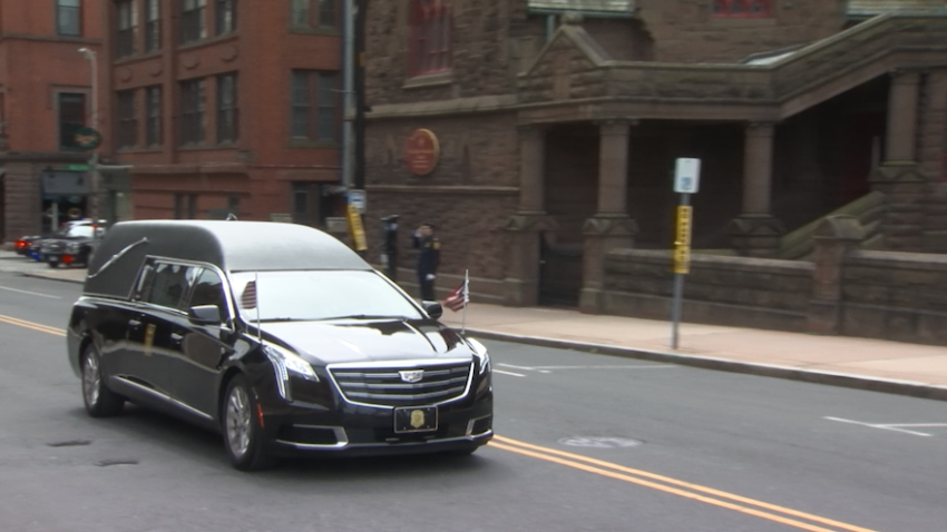 The body of Hartford Police Detective Bobby Garten was taken from his funeral at the XL Center downtown to Village Cemetery, where he was laid to rest in his hometown.