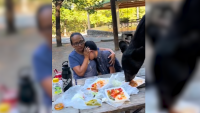 Video shows Mexican mother shielding son as bear leaps on picnic table, devours tacos