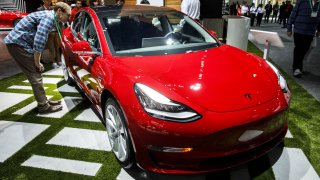 The Tesla Model 3 vehicle is displayed ahead of the Los Angeles Auto Show in Los Angeles.