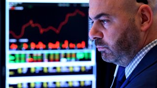 Traders work during the opening bell at the New York Stock Exchange.