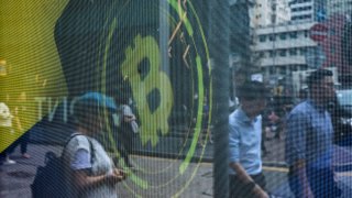 The logo for bitcoin is seen on a screen in Hong Kong, China, on May 24, 2023.