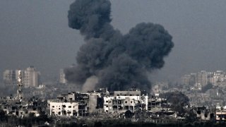 A picture taken from near the southern Israeli city of Sderot on October 28, 2023, shows smoke raising during an Israeli air strike in the northern Gaza Strip. 