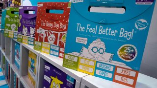 Products are displayed in the Open the Joy booth at the 2023 Toy Fair, in New York's Javits Center,