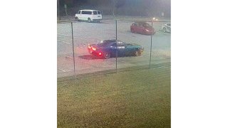 blue Dodge Challenger outside of a central Georgia jail. Authorities are looking to talk to the driver of the vehicle for possible involvement in the escape.