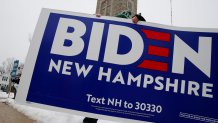 DOVER, NH - FEBRUARY 11:  Keith Ecklund, an electrician from Local 103 in Massachusetts carries a Joe Biden sign outside the the Parish of the Assumption (St. Joseph Church) in Dover, NH on February 11, 2019. Election day in the New Hampshire primary has finally arrived. The leading Democratic presidential candidates made sharply divergent final pitches across New Hampshire on Monday, as voters faced down the possibility of delivering another split verdict in the partys desperate effort to figure out how to defeat President Trump. (Photo by Craig F. Walker/The Boston Globe via Getty Images)