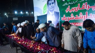 File. Members of Shiite Ulema Council, a Shiite Muslim religious-political organization, light candles for Arshad Sharif, a Pakistani journalist killed in Kenya, during a ceremony in Karachi on October 29, 2022.