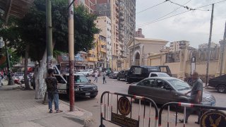 Egyptian police cordon off the site where a a policeman killed two Israeli tourists and one Egyptian in Alexandria on October 8, 2023. The policeman fired “at random” at an Israeli tour group visiting Alexandria using “his personal weapon”, the state-affiliated private television Extra News said quoting a security source. (Photo by AFP) (Photo by -/AFP via Getty Images)