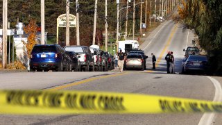 Lewiston, ME - October 28: Police and FBI were still at Schemengees Bar and Grille Saturday morning as they gather evidence at the location which was the scene of one of two mass shootings in Lewiston that killed 18 people.