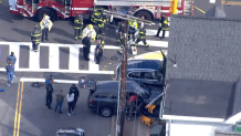 First responders at the scene of an apparent car crash in Malden, Massachusetts, on Thursday, Oct. 19, 2023.