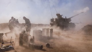 An Israeli artillery unit fires from the Israeli side of the border towards the Gaza Strip on November 06, 2023 in southern Israel. 