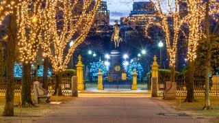 View of the historic architecture of Boston in Massachusetts, USA showcasing  its Christmas lights on Commonwealth Avenue at night.