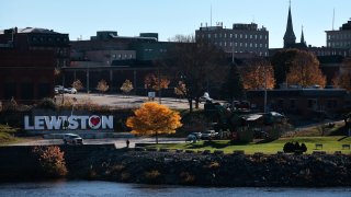 Lewiston, ME – November 1: A heart is adhered to the Lewiston sign at Veterans Memorial Park. (Photo by Craig F. Walker/The Boston Globe via Getty Images)