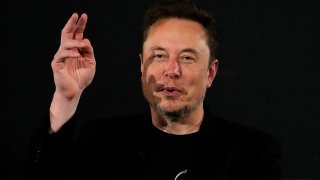 FILE - Elon Musk, owner of social media platform X, gestures during an event with Britain's Prime Minister Rishi Sunak in London on Nov. 2, 2023.