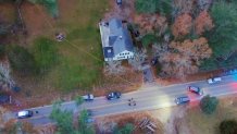 Investigators are seen at a home in Wareham, Massachusetts, on Monday, Nov. 27, 2023.