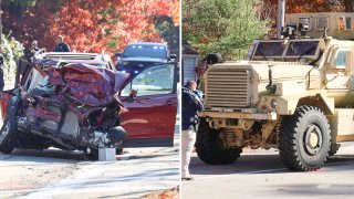 A badly damaged SUV and a military vehicle at the scene of a car crash in Marshfield, Massachusetts, on Monday, Nov. 20, 2023.