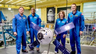 The crew members of the Artemis 2 mission of the U.S. space agency NASA, left to right, Reid Wiseman Victor Glover, Christina Koch and Jeremy Hansen, stand at a press event in the ArianeGroup building.