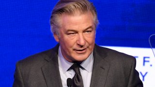 FILE - Alec Baldwin speaks at the Ripple of Hope Award Gala at New York Hilton Midtown on Thursday, Dec. 9, 2021, in New York. A lawsuit against Alec Baldwin filed by relatives of a U.S. Marine killed in Afghanistan has been resolved without the actor paying any of the $25 million sought for his chastising them on social media over the 2021 insurrection at the U.S. Capitol.
