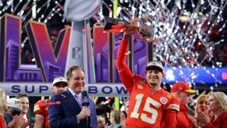 Kansas City Chiefs’ Patrick Mahomes celebrates with the Vince Lombardi Trophy after winning Super Bowl LVIII.