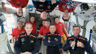 In this image from video provided by NASA, the 11 International Space Station crew members represent Expedition 70