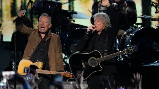 Bruce Springsteen, left, and Jon Bon Jovi perform