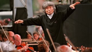 Conductor Seiji Ozawa leading the Boston Symphony Orchestra for Beethoven's Ninth Symphony at a performance on Boston Common at a performance celebrating his 25th year with the symphony.