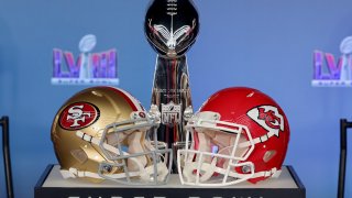 LAS VEGAS, NEVADA – FEBRUARY 05: A general view of the Vince Lombardi Trophy with the San Francisco 49ers and Kansas City Chiefs helmets during a press conference ahead of Super Bowl LVIII at Allegiant Stadium on February 05, 2024 in Las Vegas, Nevada. (Photo by Ethan Miller/Getty Images)