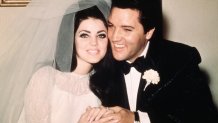 Las Vegas, Nev. Entertainer, Elvis Presley sits cheek to cheek wit his bride, the former Priscilla Ann Beaulieu