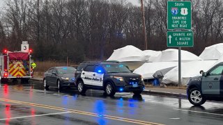 First responders at the scene of a death investigation by the Neponset River in Milton, Massachusetts, on Tuesday, Feb. 13, 2024.
