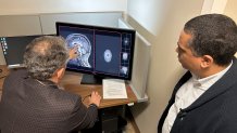 A detailed brain scan is shown as doctors do work at the Translational Research Center for Traumatic Brain Injuries and Stress Disorders. 