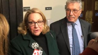 Suspended Cannabis Control Commission Chairwoman Shannon O’Brien and her lawyer, Max Stern, spoke with reporters after a Dec. 14, 2023 hearing in Suffolk Superior Court.