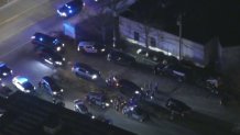 A large number of police cruisers involved in the search for an escaped prisoner in Waltham, Massachusetts, on Monday, Feb. 26, 2024.