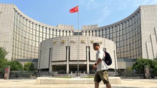 A man walks past the People’s Bank of China (PBOC) building on July 20, 2023 in Beijing, China. (Photo by Jiang Qiming/China News Service/VCG via Getty Images