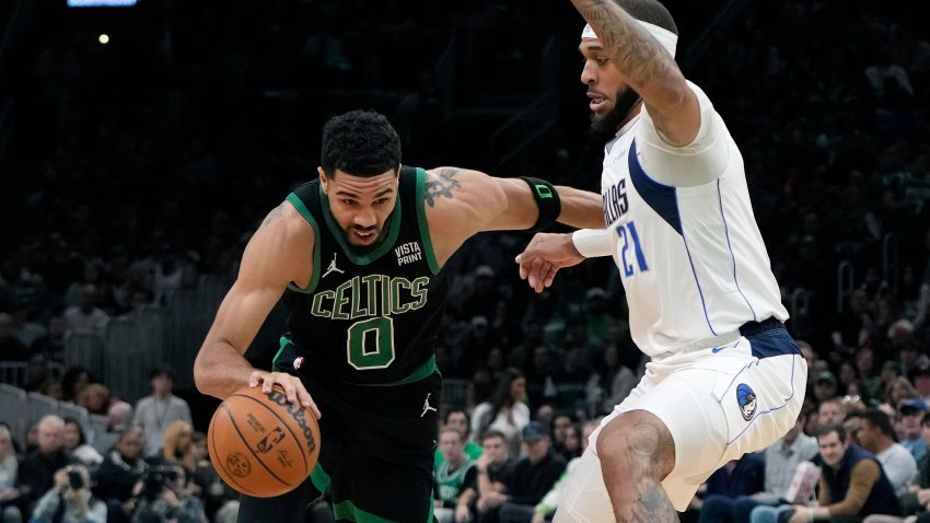 Boston Celtics’ Jayson Tatum (0) drives past Dallas Mavericks’ Daniel Gafford (21) during the first half of an NBA basketball game, Friday, March 1, 2024, in Boston.