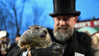 Groundhog Club handler A.J. Dereume holds Punxsutawney Phil, the weather prognosticating groundhog, during the 138th celebration of Groundhog Day on Gobbler's Knob in Punxsutawney, Pa., Friday, Feb. 2, 2024.