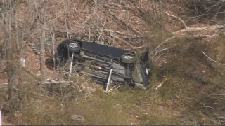 A crashed car off I-495 in Bellingham, Massachusetts, on Friday, March 22, 2024.