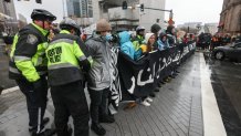 Police make arrests during a pro-Palestinian demonstration that disrupted traffic outside Boston's South Station on Thursday, March 7, 2024.