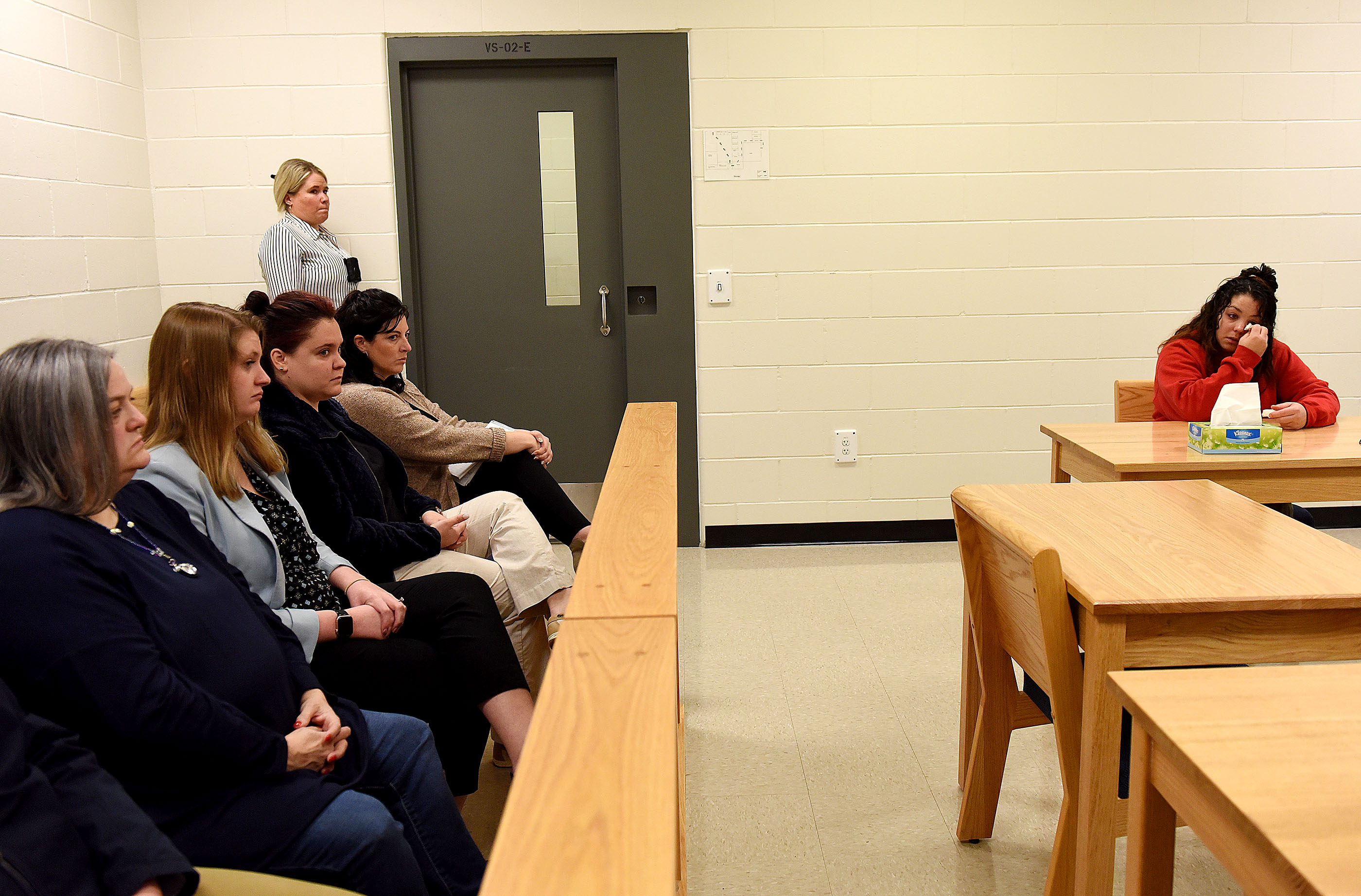 Kayla Montgomery, the estranged wife of convicted murderer Adam Montgomery, the man who beat his 5-year-old daughter Harmony to death in 2019, wipes away tears during questions from the parole board at the New Hampshire Correctional Facility for Women in Concord, N.H., on March 7, 2024. At left is Michelle Raftery, a foster mother for Harmony.