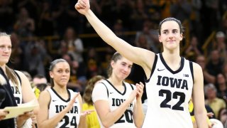 Caitlin Clark of the Iowa Hawkeyes waves to the crowd during senior day festivities  after the match-up against the Ohio State Buckeyes at Carver-Hawkeye Arena on March 3, 2024 in Iowa City, Iowa.