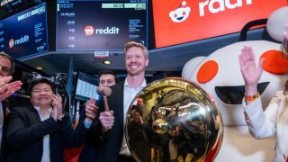 Reddit CEO Steve Huffman stands on the floor of the New York Stock Exchange (NYSE) while ringing a bell on the floor setting the share price at $47 in its initial public offering (IPO) on March 21, 2024 in New York City. 