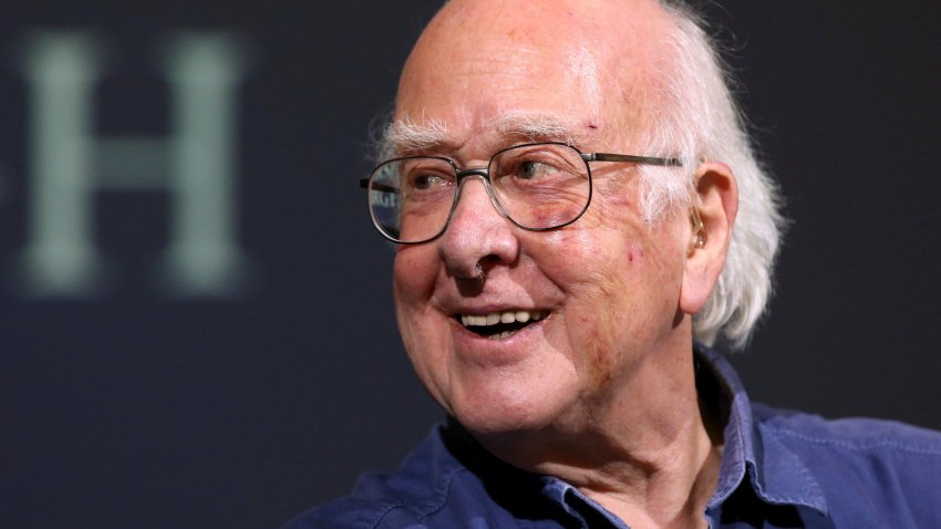 FILE – Britain’s Professor Peter Higgs smiles during a press conference in Edinburgh, Scotland, on Oct. 11, 2013. The University of Edinburgh says Nobel prize-winning physicist Peter Higgs, who proposed the existence of the Higgs boson particle, has died at 94. Higgs predicted the existence of a new particle — the so-called Higgs boson  — in 1964. But it would be almost 50 years before the particle’s existence could be confirmed at the Large Hadron Collider. Higgs won the 2013 Nobel Prize in Physics for his work, alongside Francois Englert of Belgium.