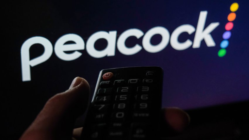 TV remote control is seen with Peacock logo displayed on a screen in this illustration photo taken in Krakow, Poland on February 6, 2022. (Photo by Jakub Porzycki/NurPhoto via Getty Images)