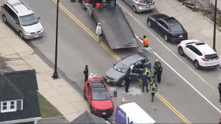 First responders at the scene of a car crash in Boston's Dorchester neighborhood on Friday, April 5, 2024.