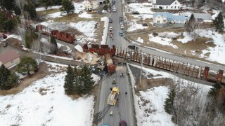 A derailed freight train that was hit by a truck carrying woodchips on Maine's Route 11 in Masardis on Wednesday, April 3, 2024.