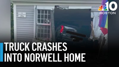 Pickup truck crashes into Norwell house