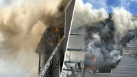 Fire burns through triple-decker home in Mattapan