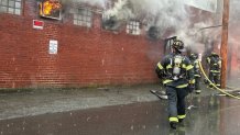 Firefighters battling a building fire in Chelsea, Massachusetts, on Thursday, May 30, 2024.