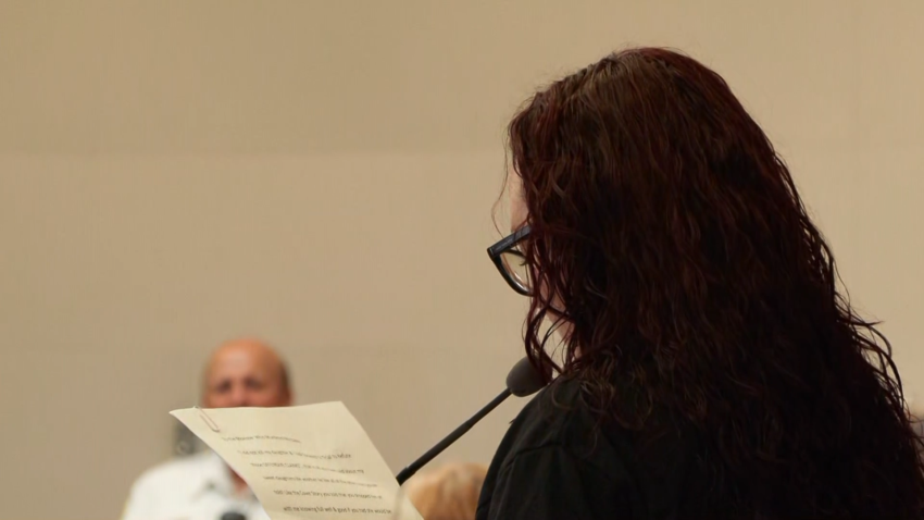 A mother reads a victim impact statement during a sentencing hearing in a courtroom.