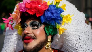 A participant poses for a photo during the annual Gay Pride parade