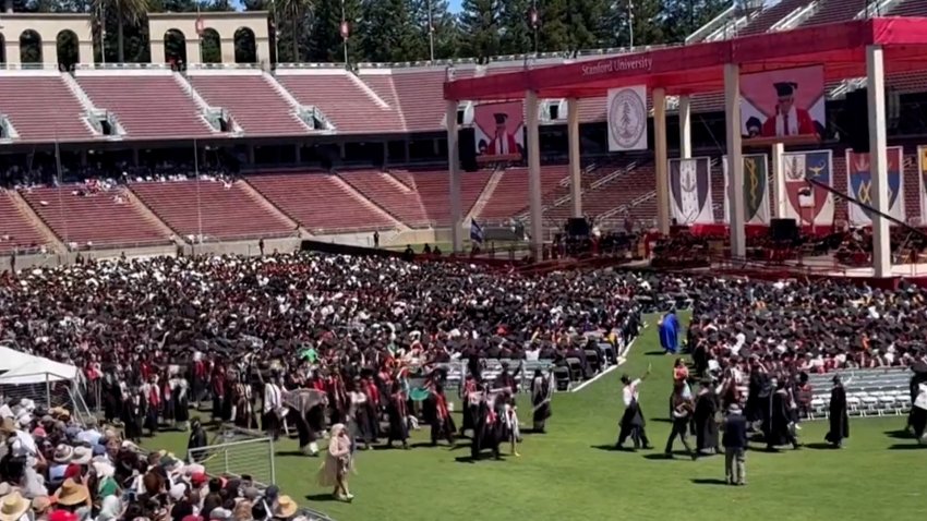 Students walk out of Stanford graduation